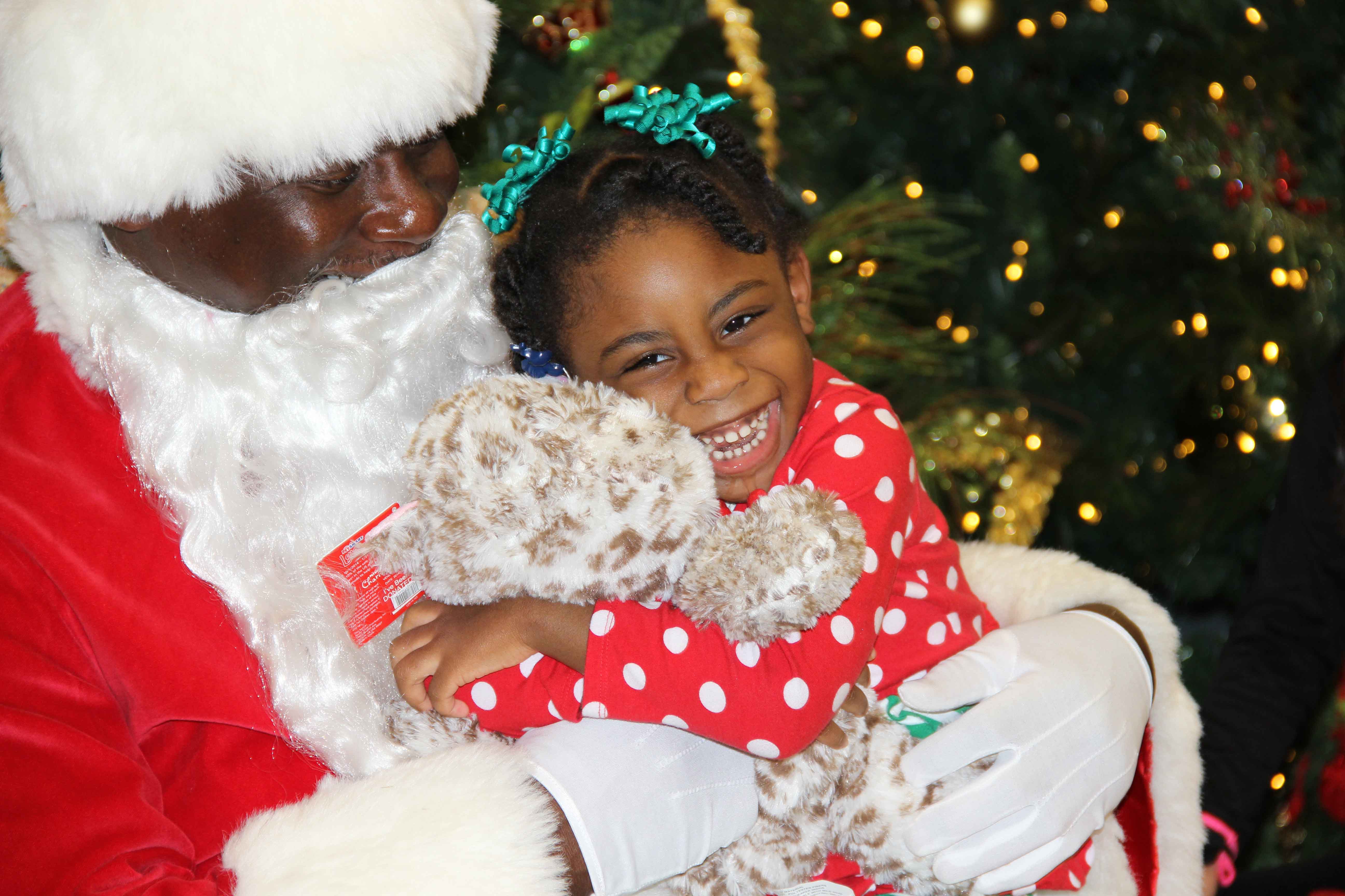 Volunteers of America Greater Baton Rouge Child with Santa on Christmas