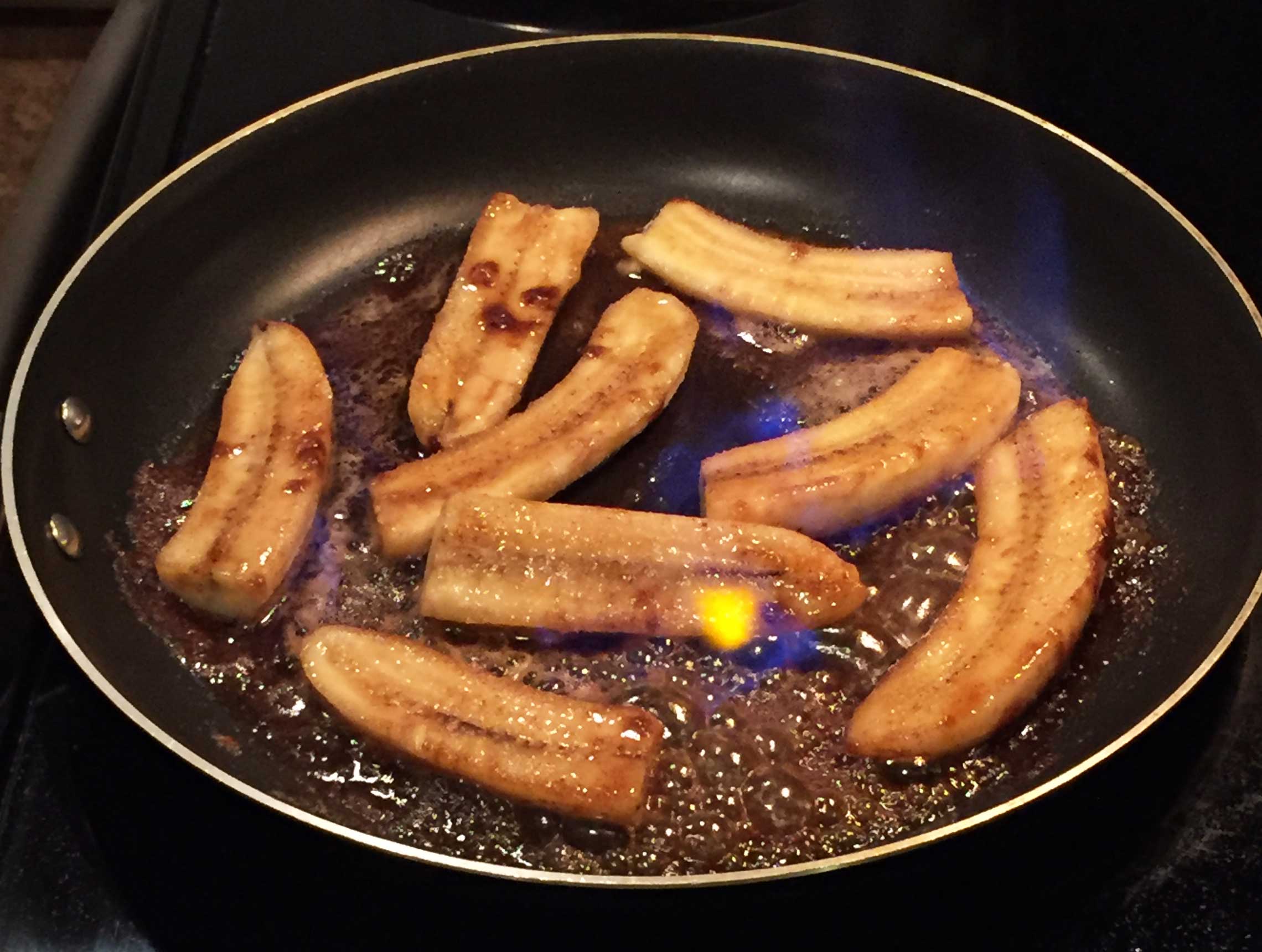 Louisiana dessert Bananas Foster cooking in pan