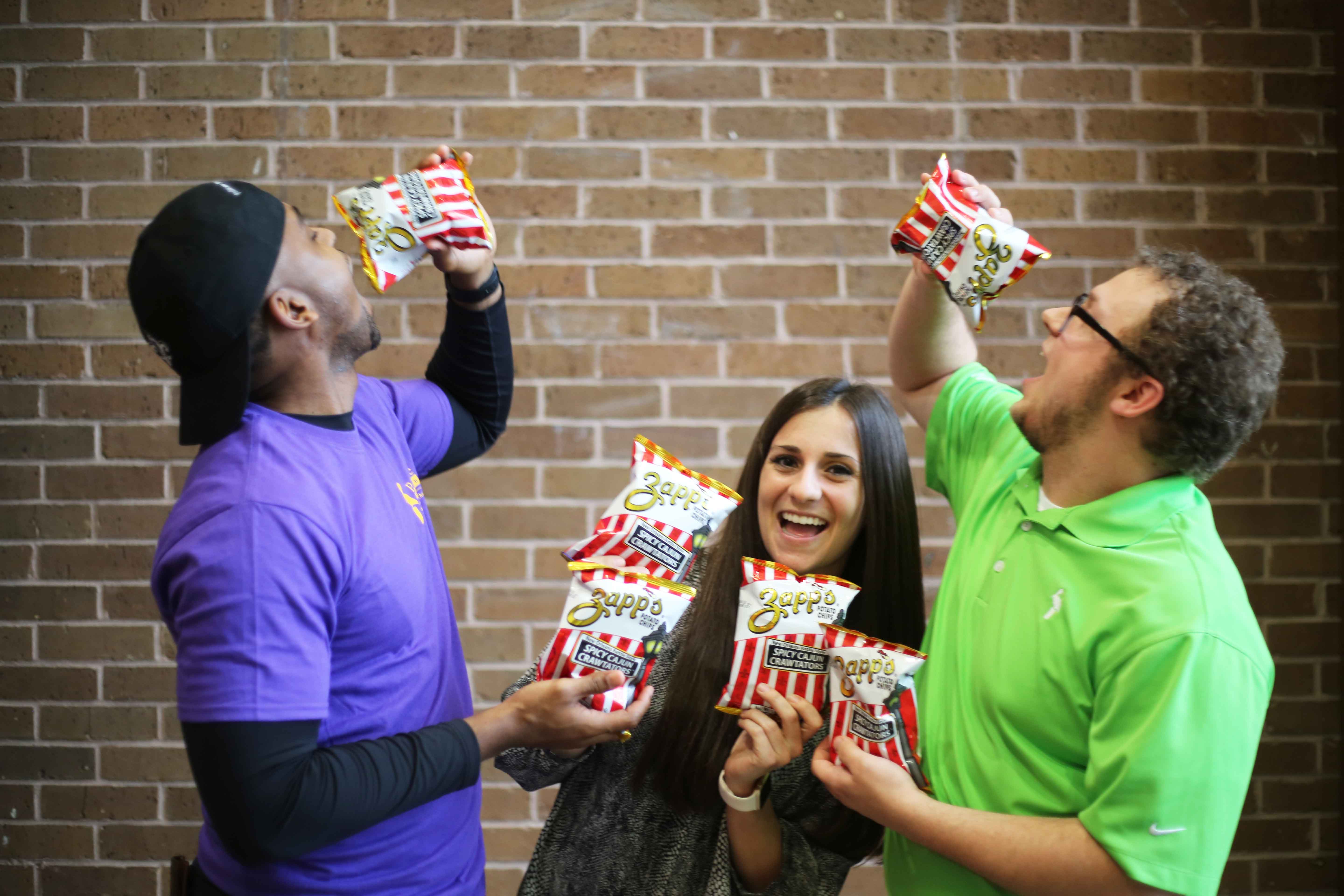 people eating zapp's potato chips