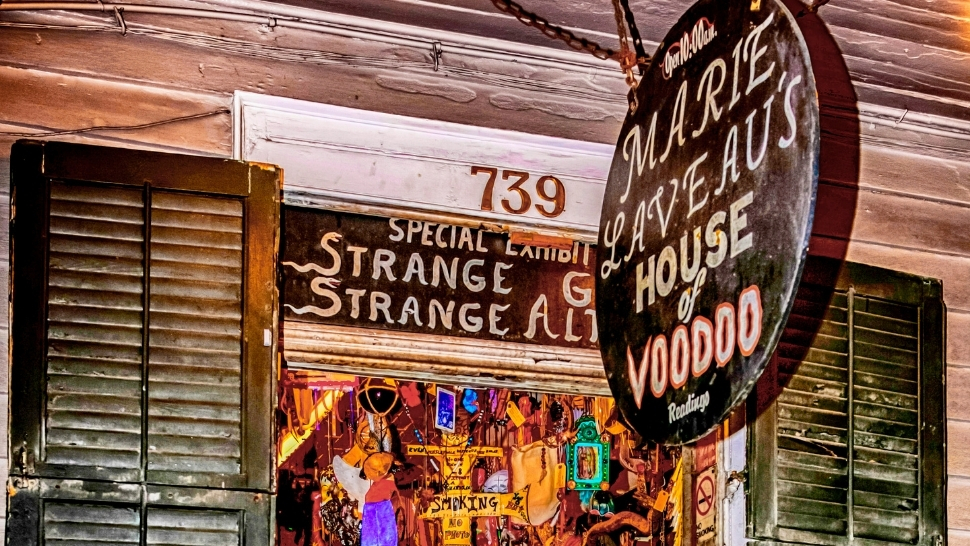 marie laveau house of voodoo sign and the inside of the store with various voodoo artifacts