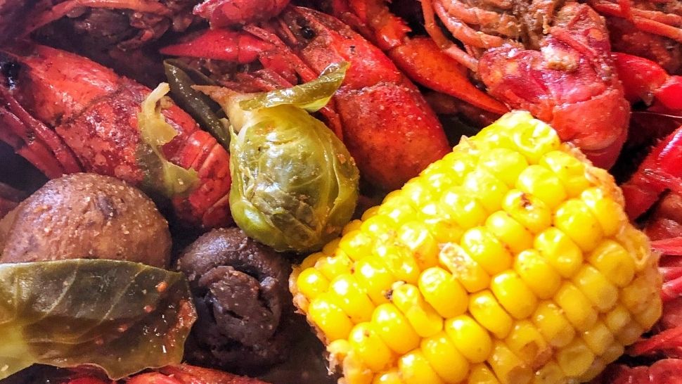 Crawfish, corn, potatoes, mushrooms, and brussels sprouts from a Louisiana crawfish boil
